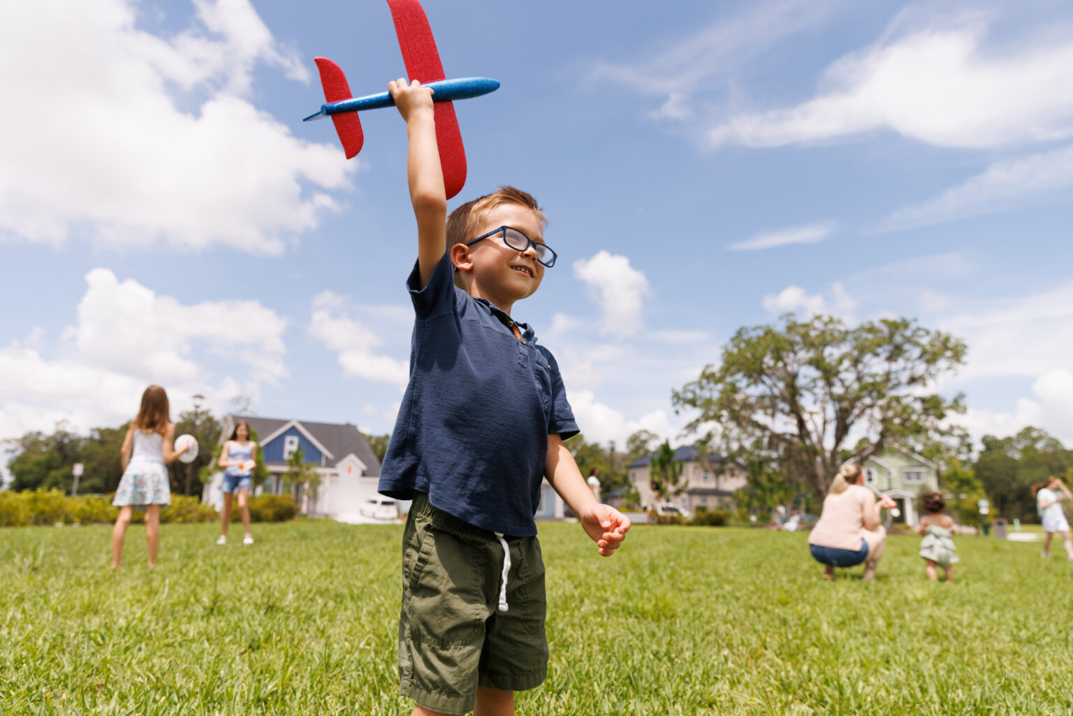 Small boy plays with plane